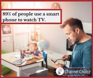 89% of people use a smart phone to watch tv. channel choice logo over dad on phone with daughter in background